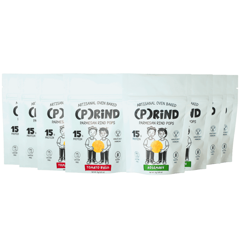 (P)RiND parmesan pops variety lineup with Tomato Basil and Rosemary bags displayed in a clean row.